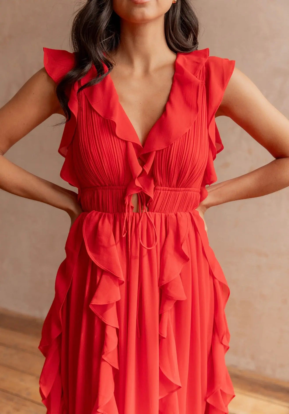 Elegant Senhorita dress by Anne Louise Boutique featuring a flowing design and stylish details, displayed on a hanger.