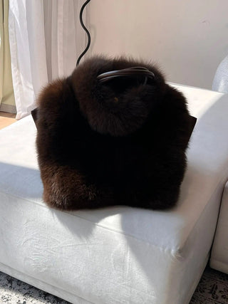 Elegant Emilia cape by Anne Louise Boutique, featuring soft fabric and stylish design, displayed on a neutral background.