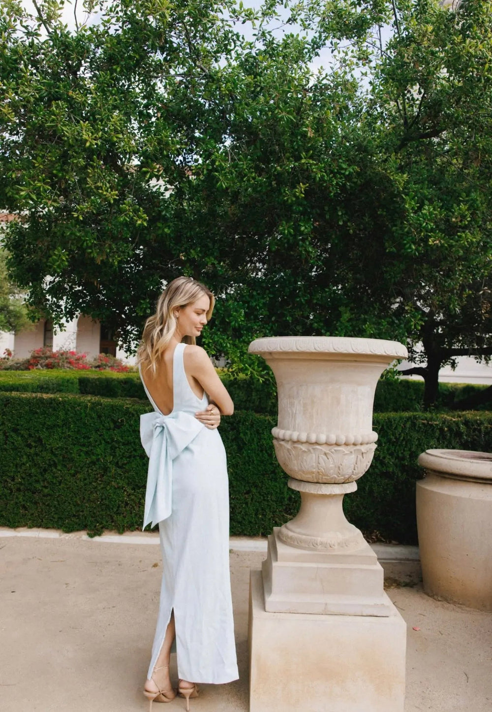 Blue bow maxi dress by Anne Louise Boutique featuring a flowing silhouette and elegant design.
