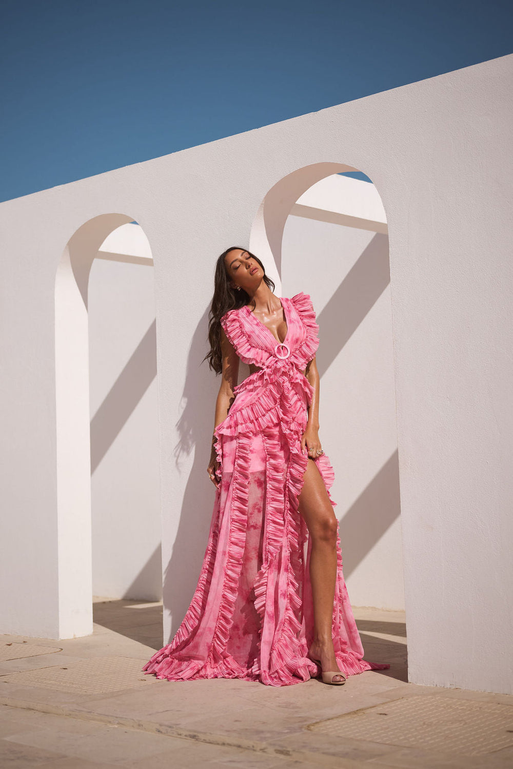 ALB London UK Rose Water Cassini Dress, elegant floral dress with flowing fabric and delicate detailing, displayed on a hanger.