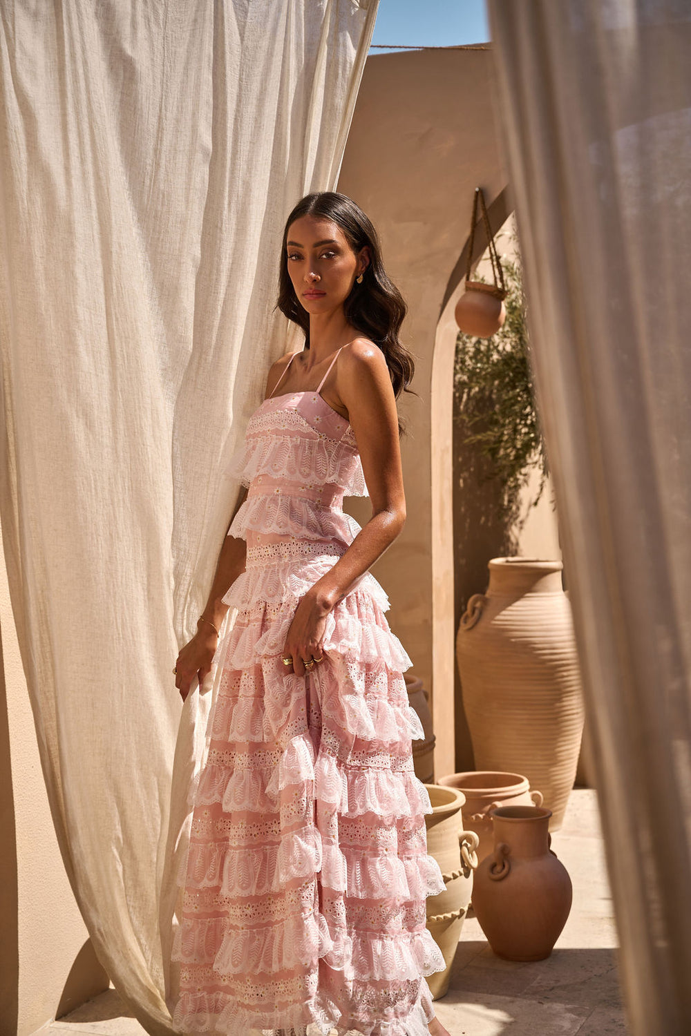 Pink LOVETTE dress by ALB, featuring a stylish and elegant design, displayed on a hanger with a soft fabric texture.