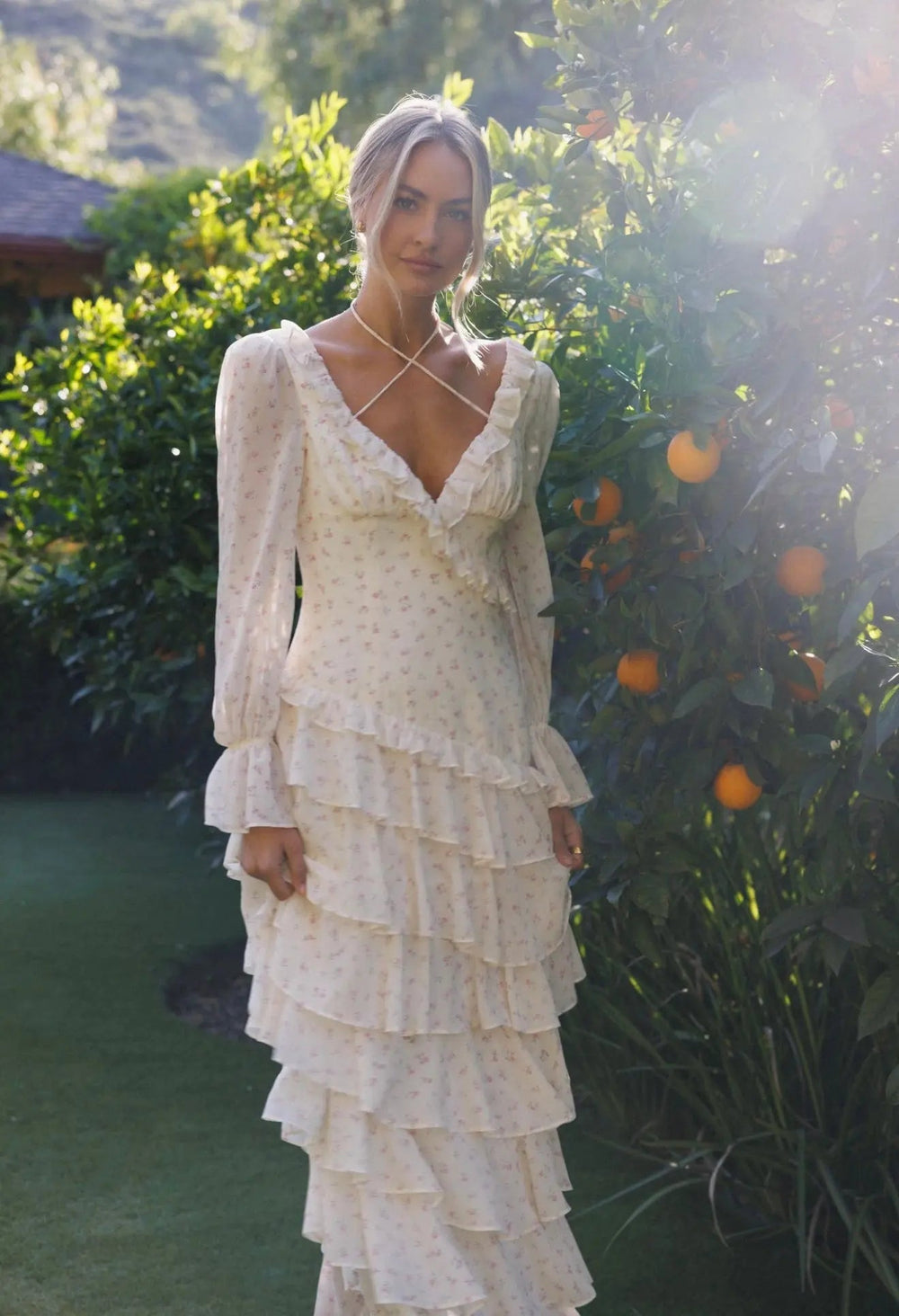 Elegant floral ruffle from Anne Louise Boutique, showcasing delicate fabric and feminine detailing in a close-up view.