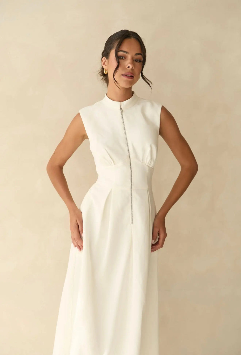White zip dress by Anne Louise Boutique featuring a fitted silhouette and stylish design, shown in full view.