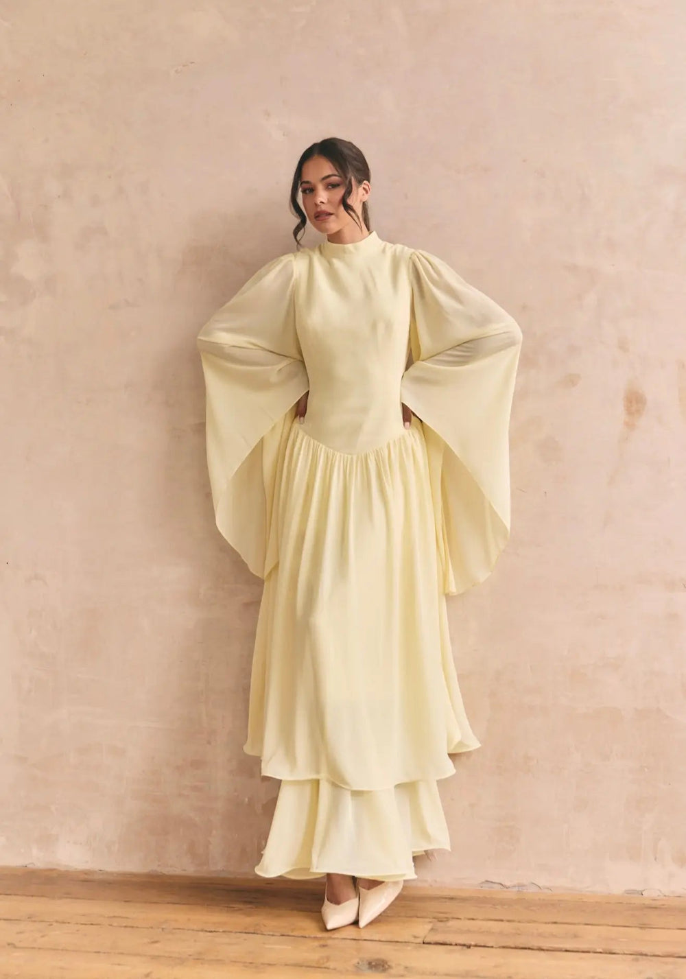 Anne Louise Boutique Limoncello Dress, full-length view showcasing the bright yellow, flowy fabric and elegant design.