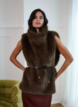 Elegant Emilia long cape by Anne Louise Boutique, featuring flowing fabric and stylish design, shown on a model.
