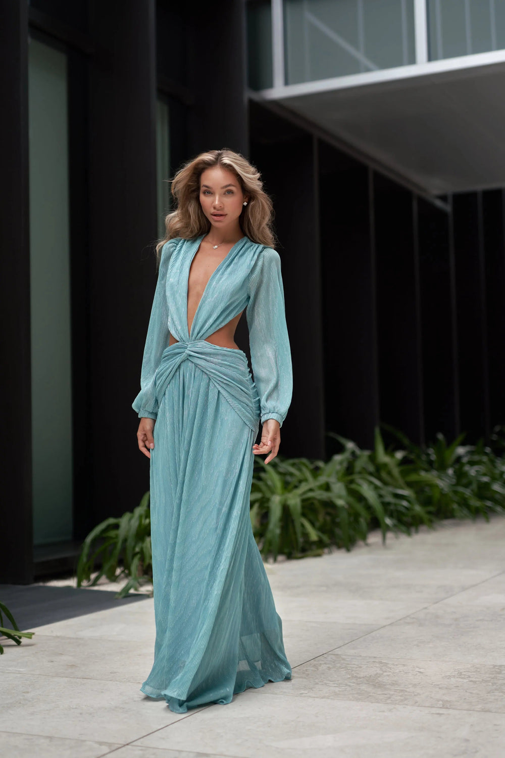 Blue dress from Anne Louise Boutique featuring flowing fabric and elegant design, perfect for stylish occasions.